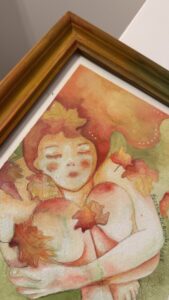 Romantico acquerello su carta con atmosfera da sogno e colori caldi con pennellate trasparenti che richiamano l’autunno, cornice personalizzata con colori che richiamano l’autunno